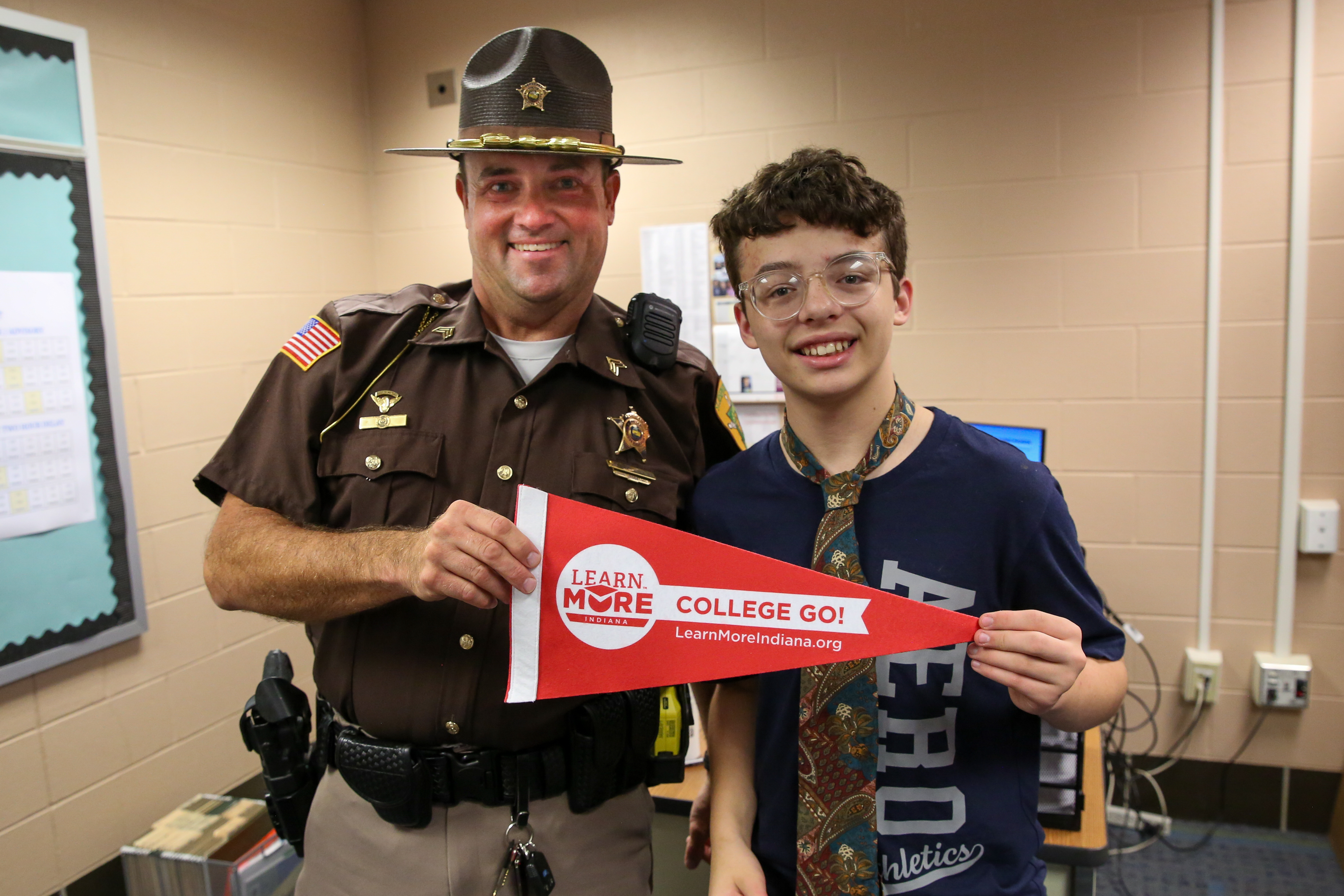 Student poses with Officer