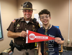 Student poses with Officer