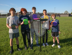 Students in front of Disc Golf Goal