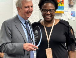 Dr. Thacker giving Jacqueline Miller an IMPACT Award