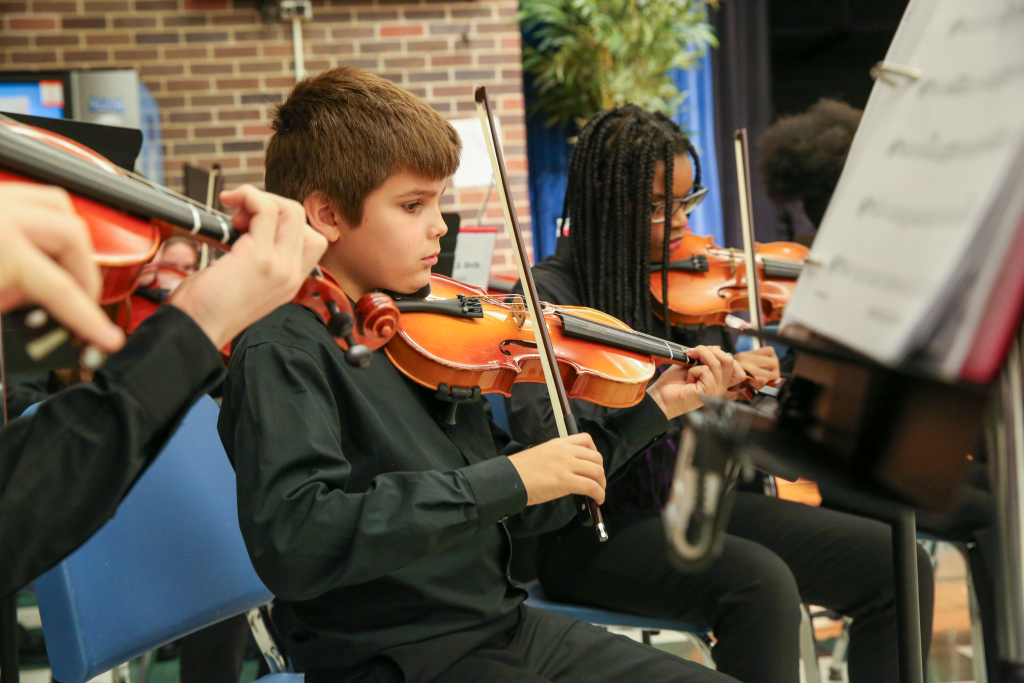 students playing violins